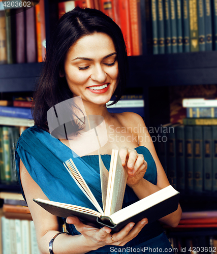 Image of young teen brunette muslim girl in library among books emotional close up bookwarm, lifestyle smiling people concept 