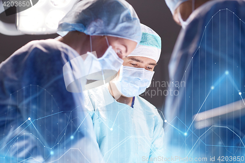 Image of group of surgeons in operating room at hospital