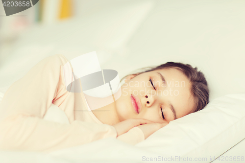 Image of girl sleeping in bed at home