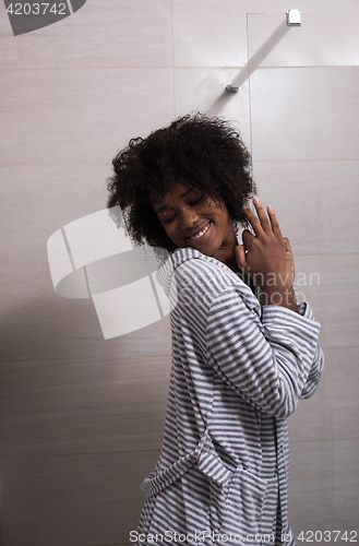 Image of beautiful black woman wearing  bathrobe