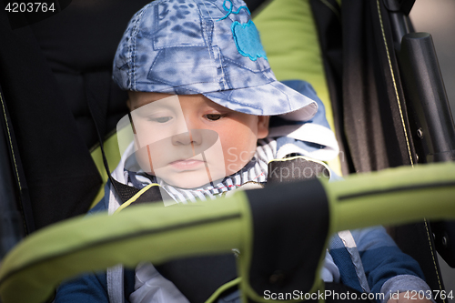 Image of baby boy sitting in the pram