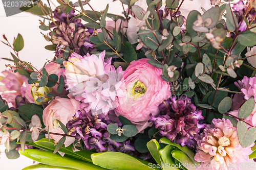 Image of Ranunkulyus bouquet of red flowers on a white background