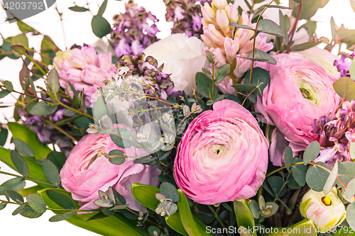 Image of Ranunkulyus bouquet of red flowers on a white background