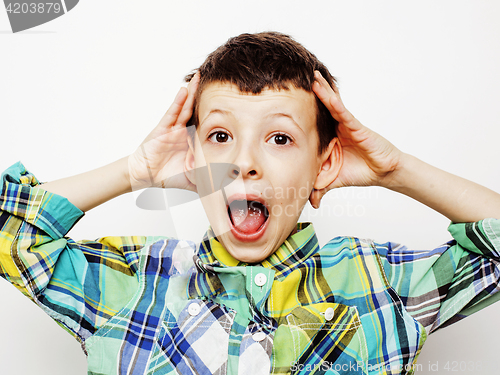 Image of young pretty little cute boy kid wondering, posing emotional face isolated on white background, gesture happy smiling close up, lifestyle people concept