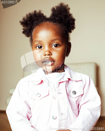 Image of little cute sweet african-american girl playing happy with toys 