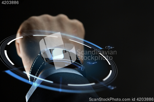 Image of close up of businessman hand with smartwatch