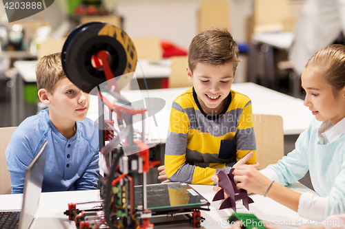 Image of happy children with 3d printer at robotics school