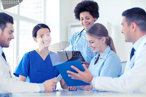 Image of group of happy doctors meeting at hospital office
