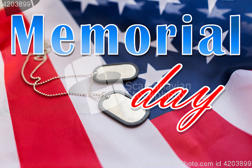 Image of memorial day words over american flag and dog tags