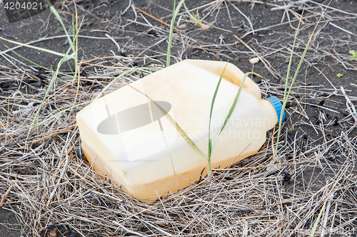 Image of Plastic container on the black beach