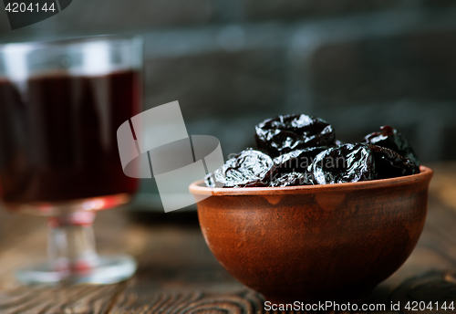 Image of drink and dry plums