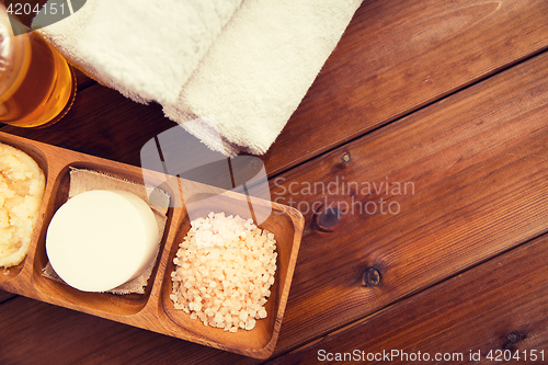 Image of close up of natural cosmetics and bath towels