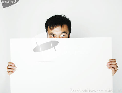 Image of pretty cool asian man holding empty white plate smiling