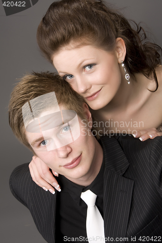 Image of Portrait of a young beautiful couple embracing.