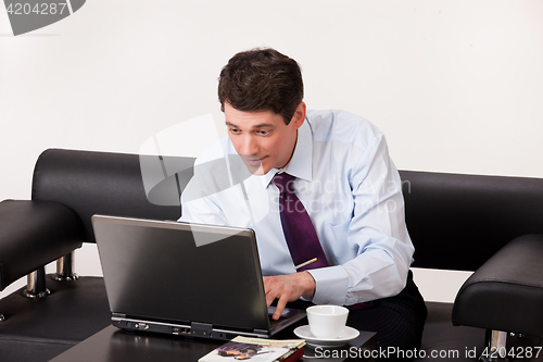 Image of Young Emotional Man In A Business Suit