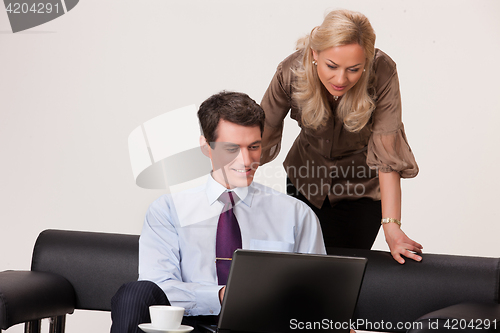 Image of Young Woman And Man with a notebook