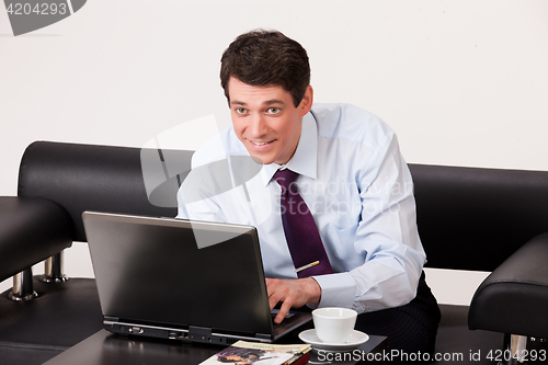 Image of Young Emotional Man In A Business Suit