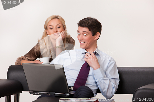 Image of Young Woman And Man with a notebook