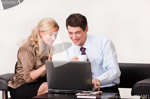 Image of Woman And Man At The Computer