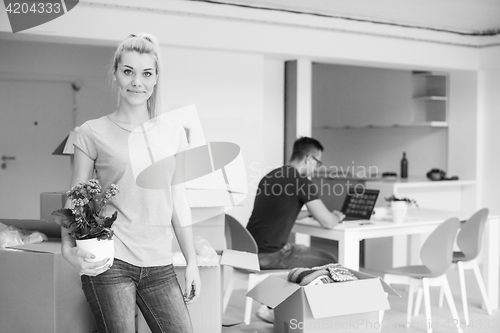 Image of young couple moving into a new home