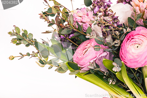 Image of Ranunkulyus bouquet of red flowers on a white background