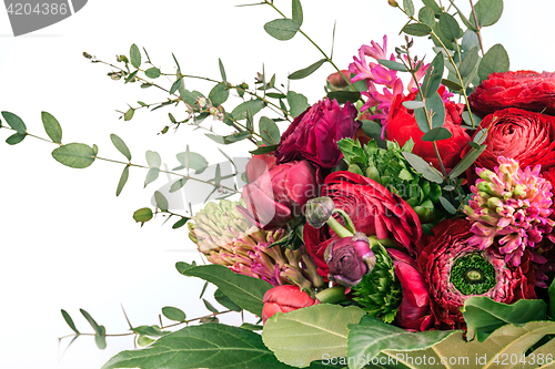 Image of Ranunkulyus bouquet of red flowers on a white background