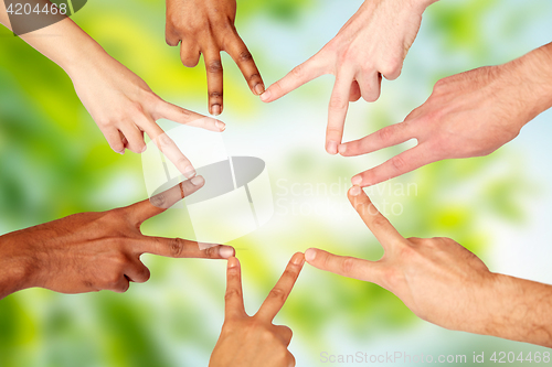 Image of group of international people showing peace sign