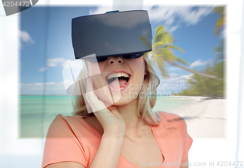 Image of woman with virtual reality headset over beach