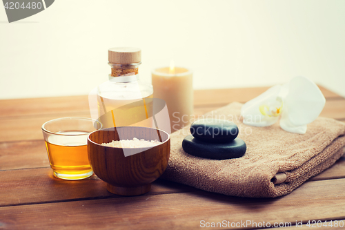 Image of close up of salt, massage oil and bath stuff