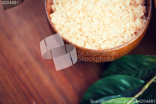 Image of close up of himalayan pink salt in wooden bowl 