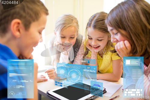 Image of group of school kids with tablet pc in classroom