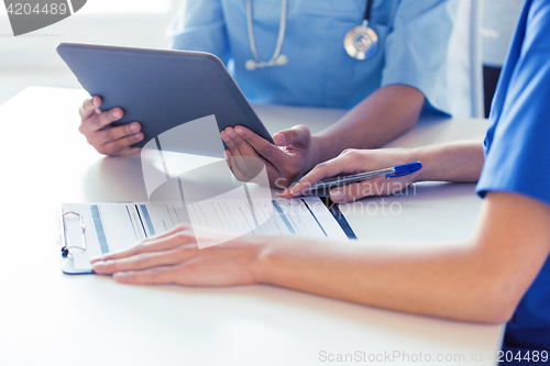 Image of close up of doctors with tablet pc at hospital