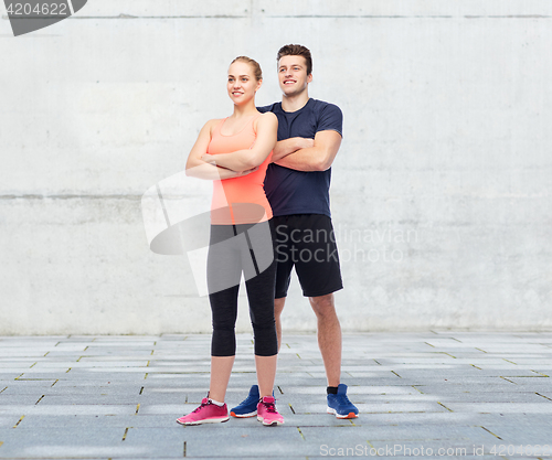 Image of happy sportive man and woman