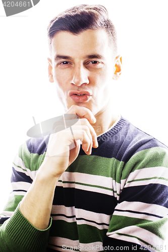 Image of Portrait of a smart serious young man standing against white bac