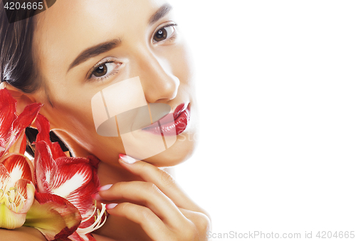 Image of young pretty brunette woman with red flower amaryllis close up i