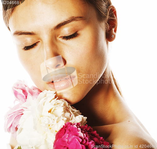 Image of young beauty woman with flower peony pink closeup makeup soft te