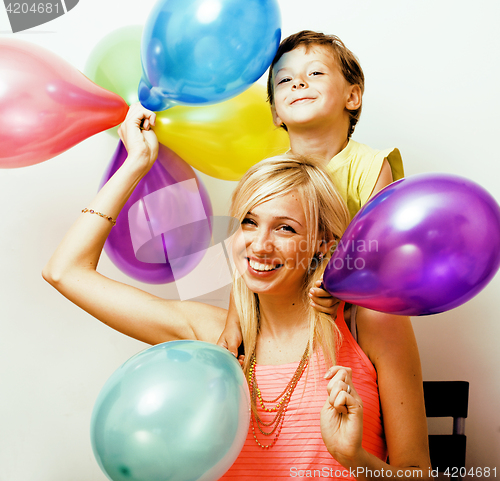 Image of pretty real family with color balloons on white background, blon