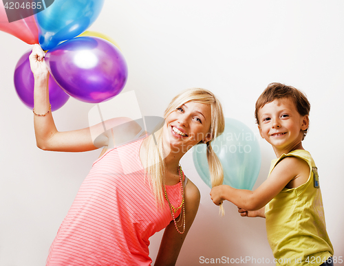 Image of pretty real family with color balloons on white background, blon