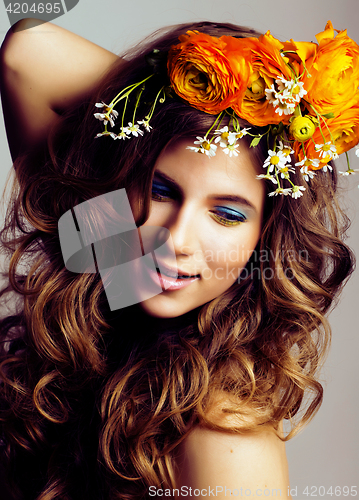 Image of Beauty young woman with flowers and make up close up, real sprin