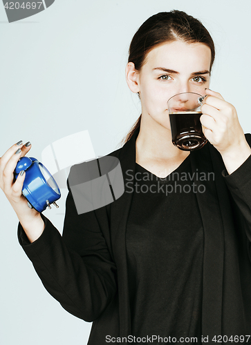 Image of young beauty woman in business style costume waking up for work 