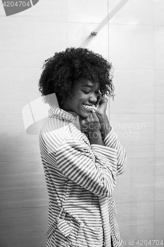 Image of beautiful black woman wearing  bathrobe