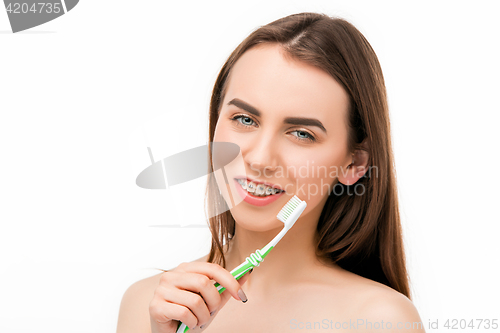 Image of Beautiful young woman with teeth braces