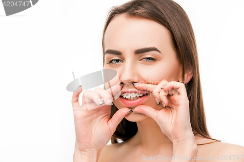 Image of Beautiful young woman with teeth braces