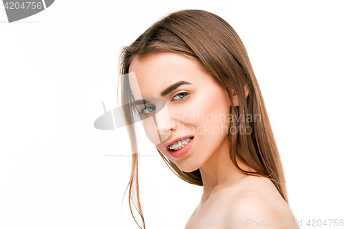 Image of Beautiful young woman with teeth braces