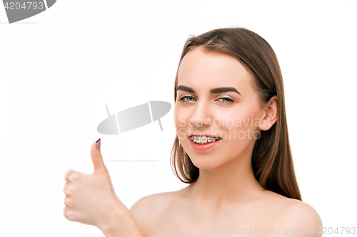 Image of Beautiful young woman with teeth braces