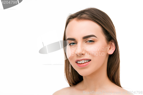 Image of Beautiful young woman with teeth braces