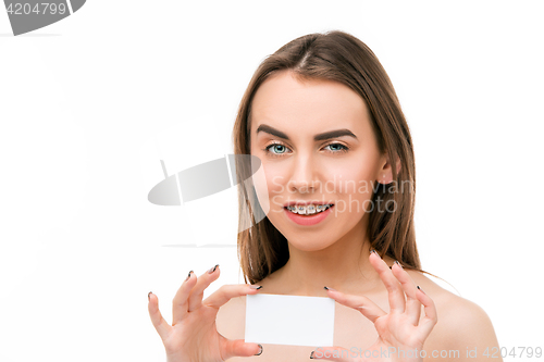 Image of Beautiful young woman with teeth braces