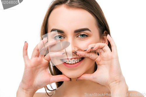 Image of Beautiful young woman with teeth braces