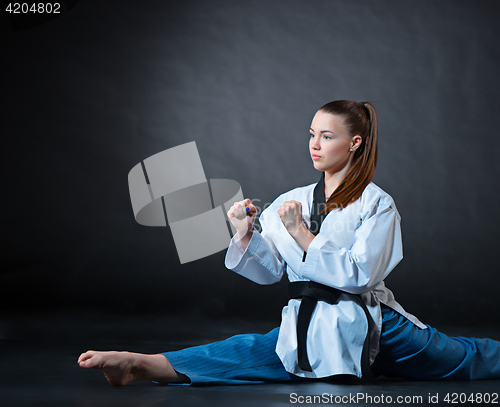 Image of The karate girl with black belt