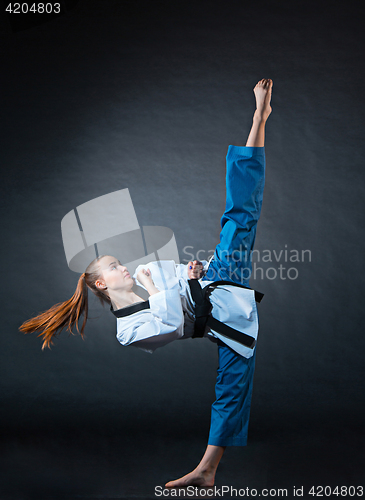 Image of The karate girl with black belt